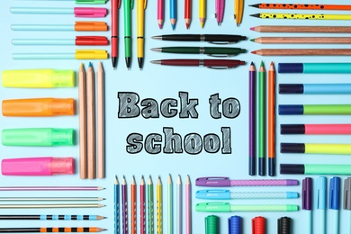 Text Back To School and different stationery on light blue background, flat lay 