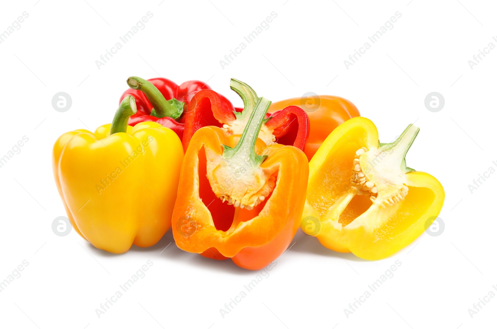 Photo of Whole and cut bell peppers on white background