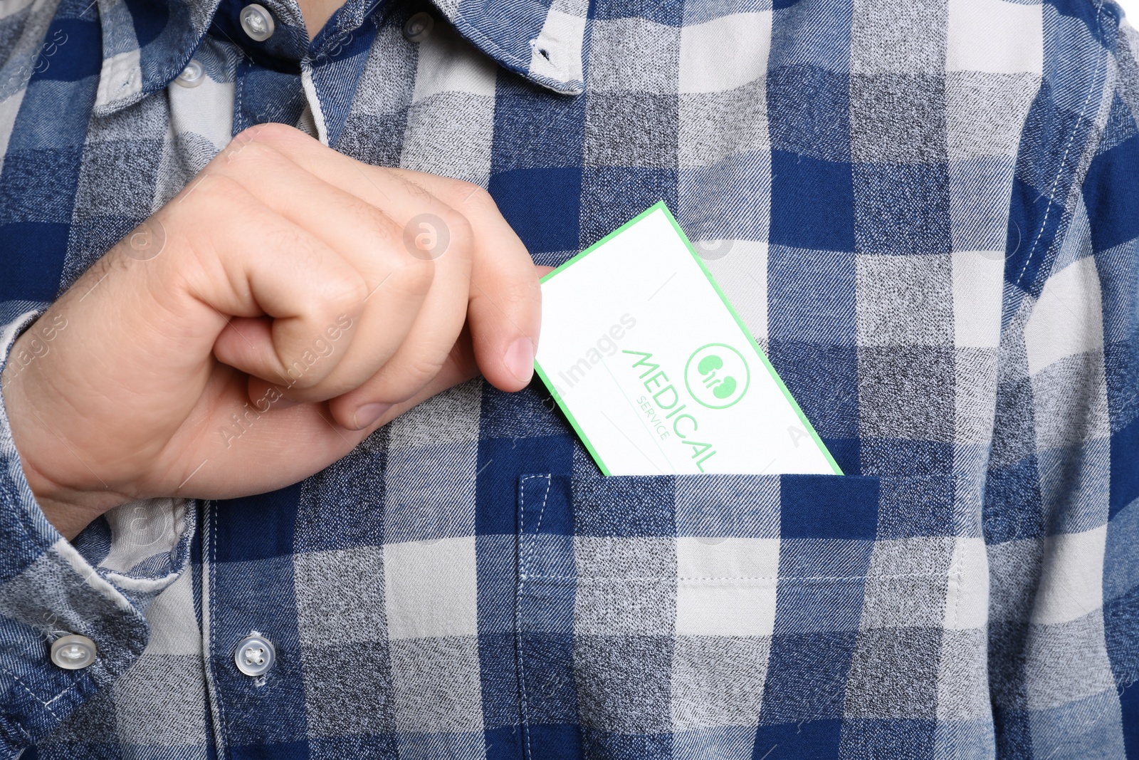 Photo of Man putting medical business card into pocket, closeup. Nephrology service