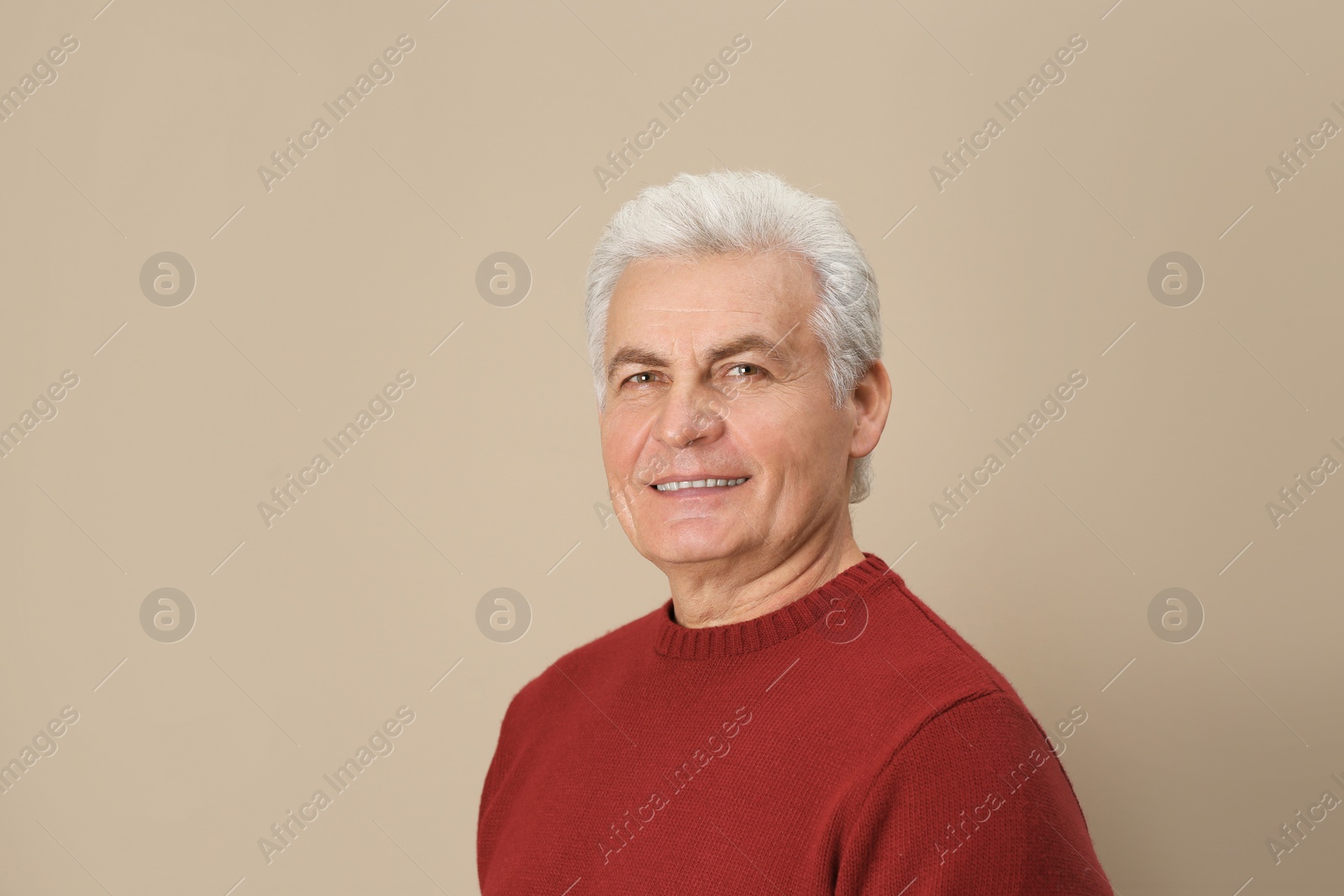 Photo of Portrait of handsome mature man on color background. Space for text