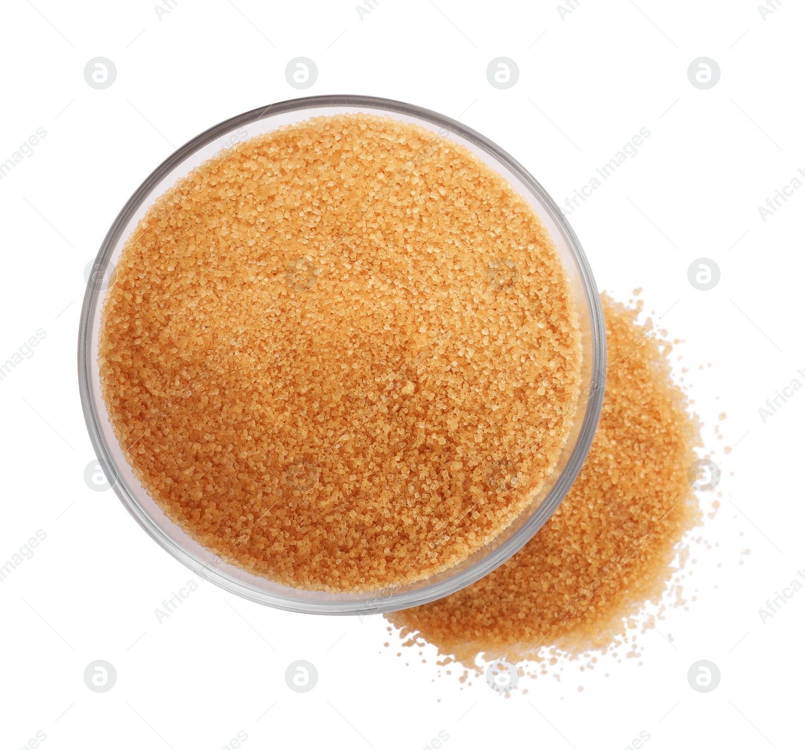 Photo of Glass bowl and granulated brown sugar on white background, top view