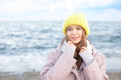 Photo of Portrait of beautiful young woman near sea