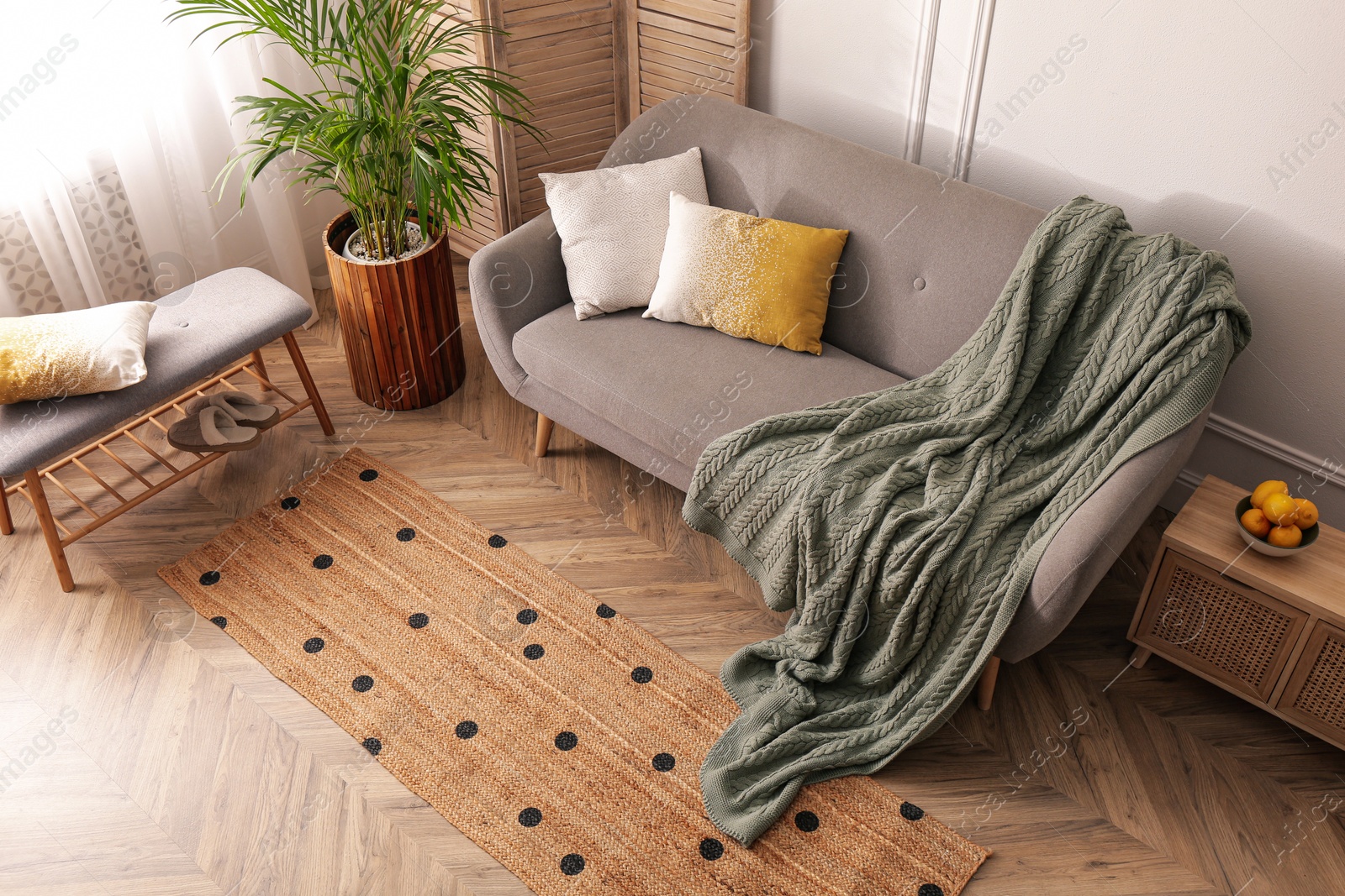 Photo of Living room interior with stylish rug and furniture, above view