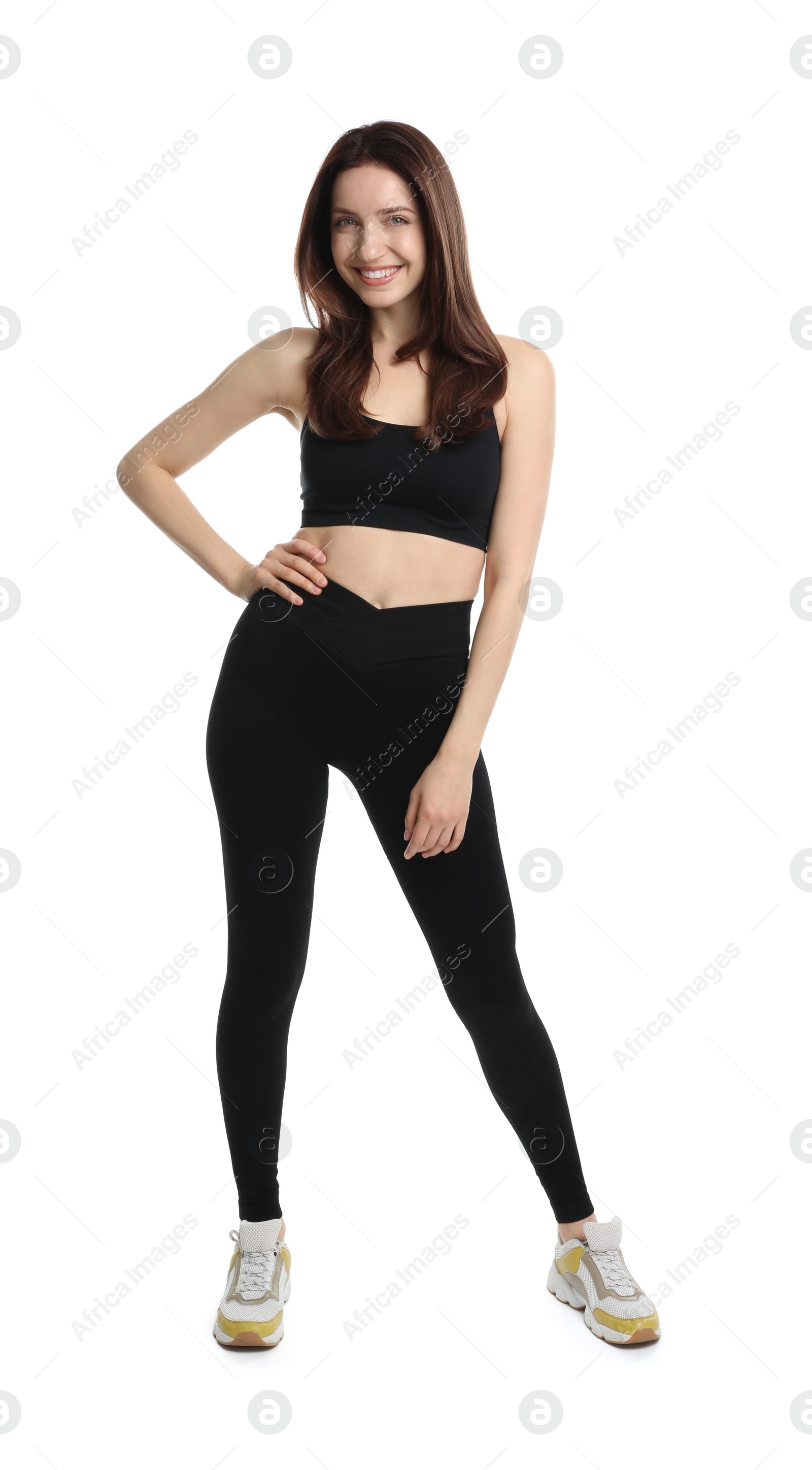 Photo of Happy young woman with slim body posing on white background