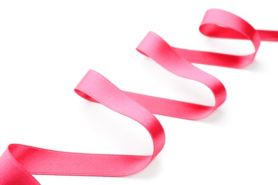 Photo of Simple pink ribbon on white background. Festive decoration