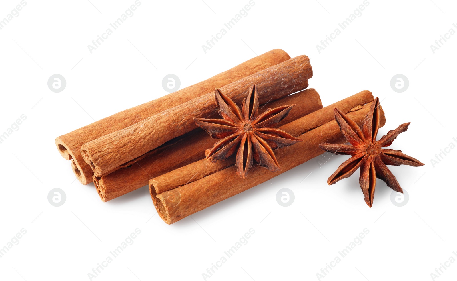 Photo of Aromatic cinnamon sticks and anise stars isolated on white