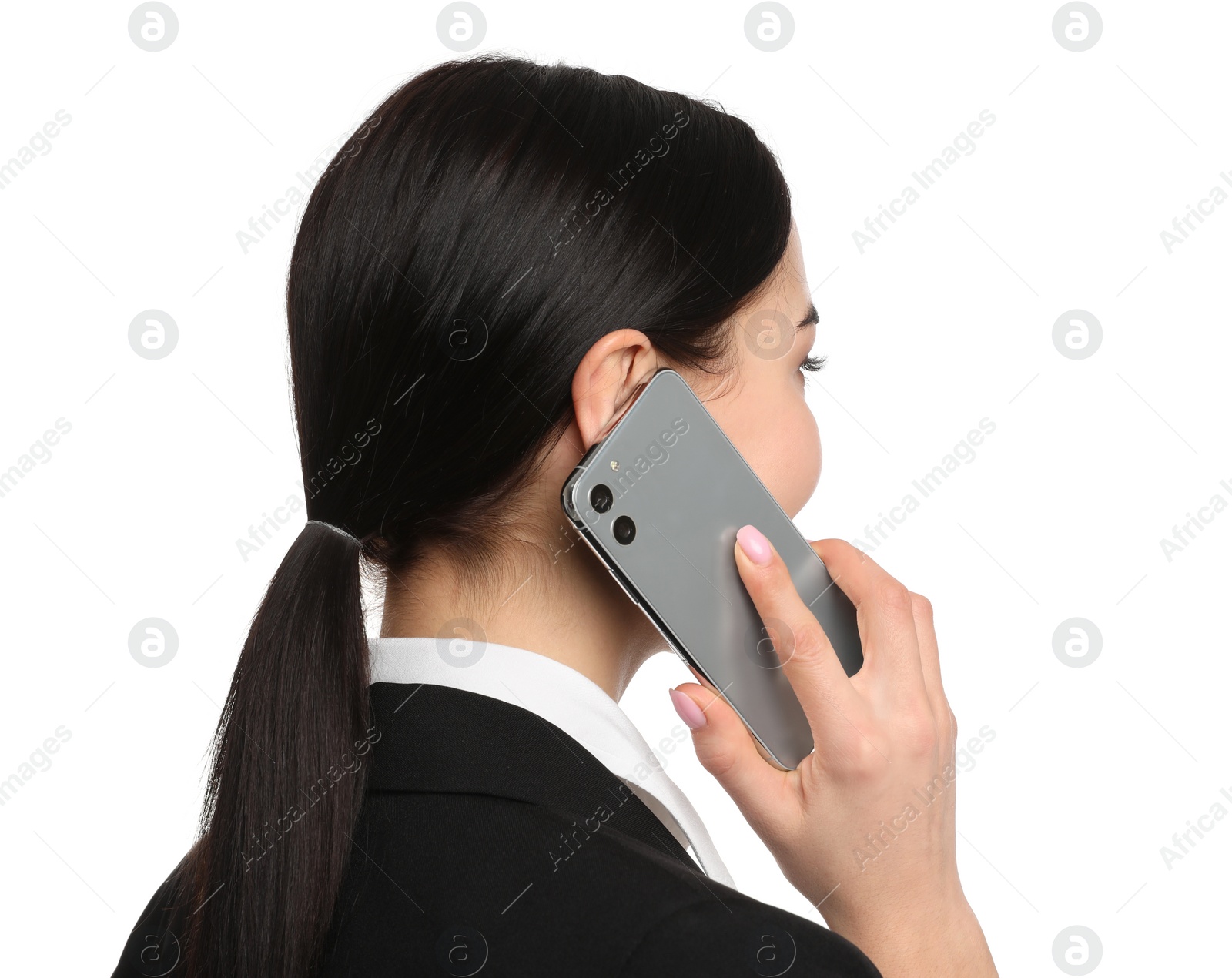 Photo of Young businesswoman talking on mobile phone against white background