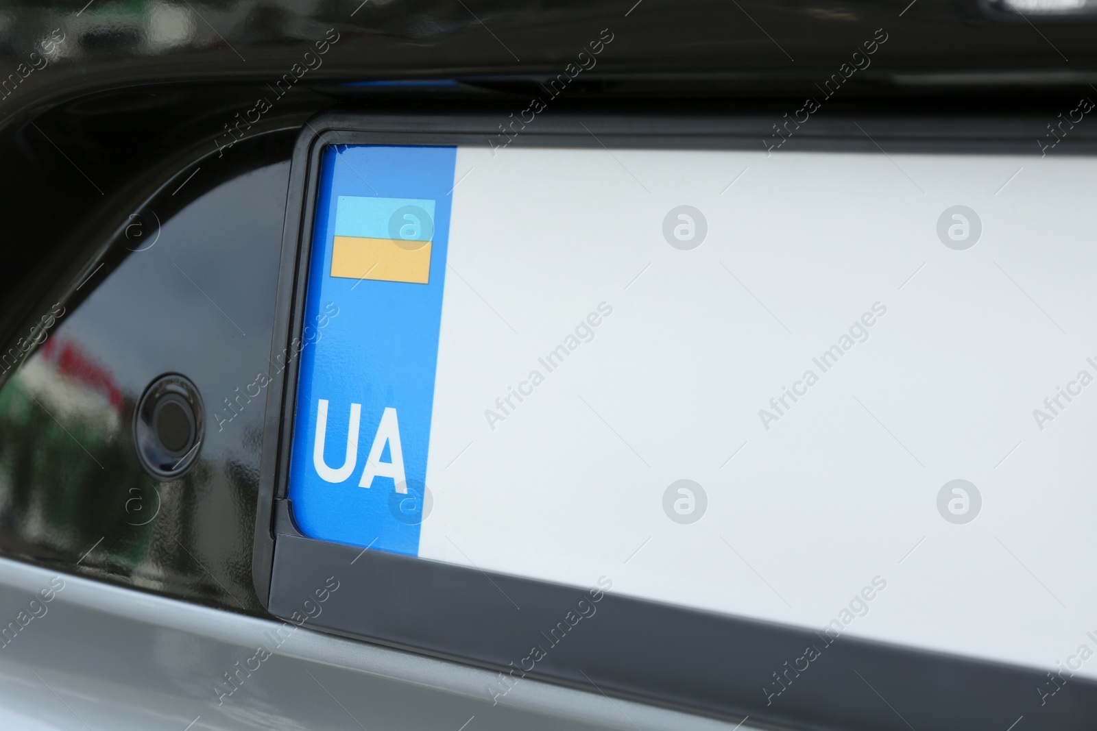 Photo of Car with vehicle registration plate, closeup view