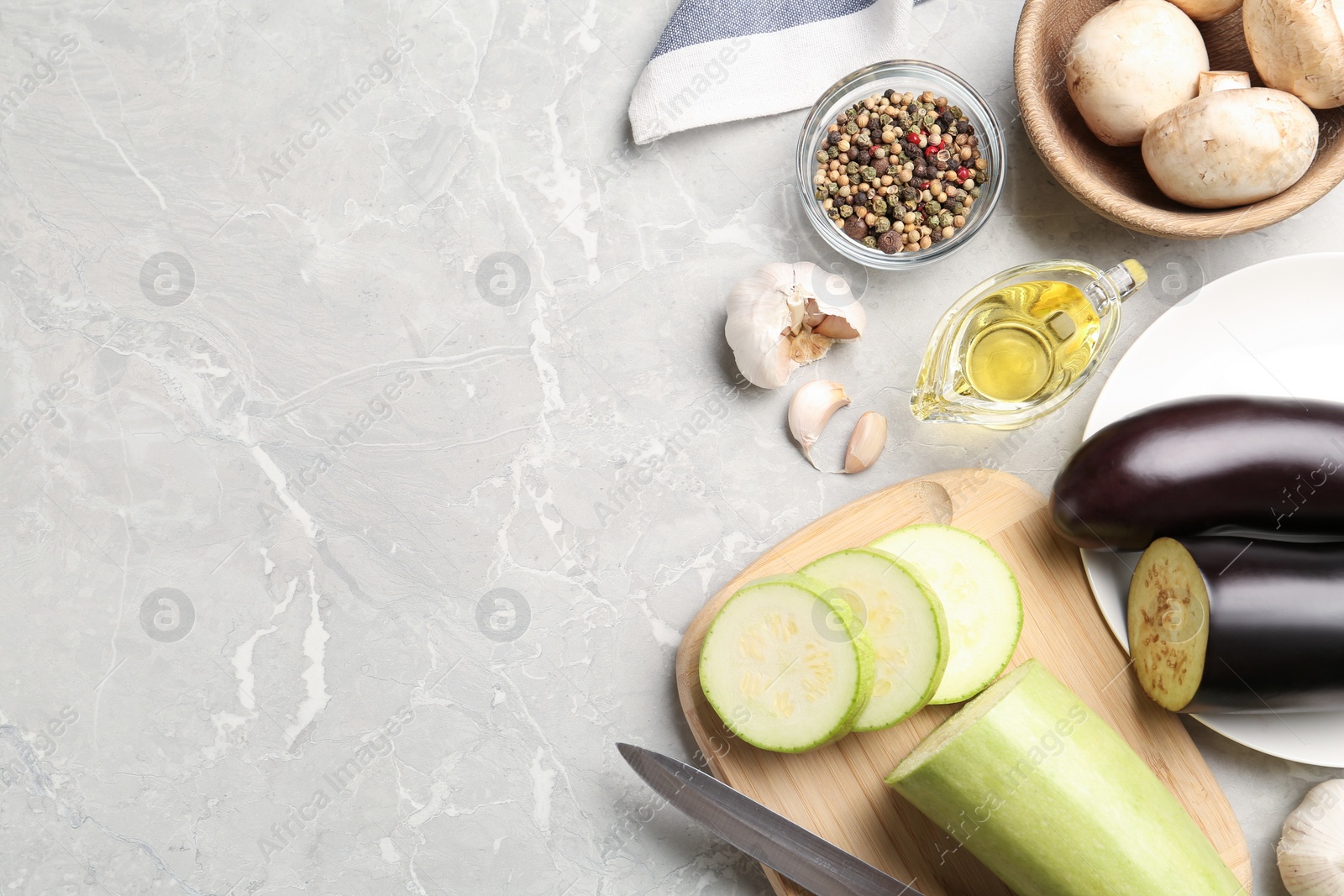 Photo of Fresh vegetables on marble table, flat lay. Space for text