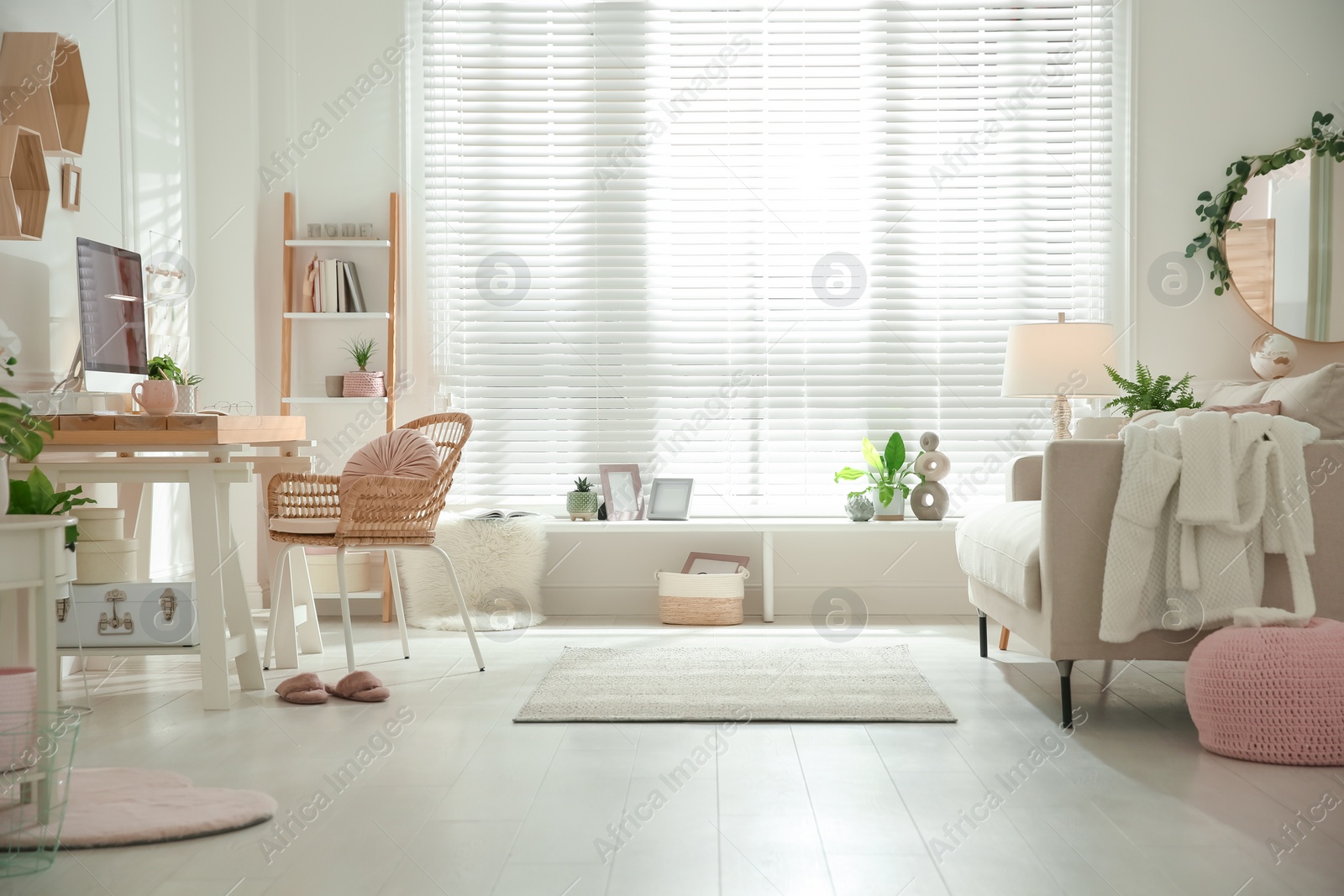 Photo of Stylish home office interior with sofa and comfortable workplace