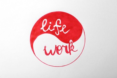 Photo of Yin Yang sign with words Work and Life on white background. Balance concept