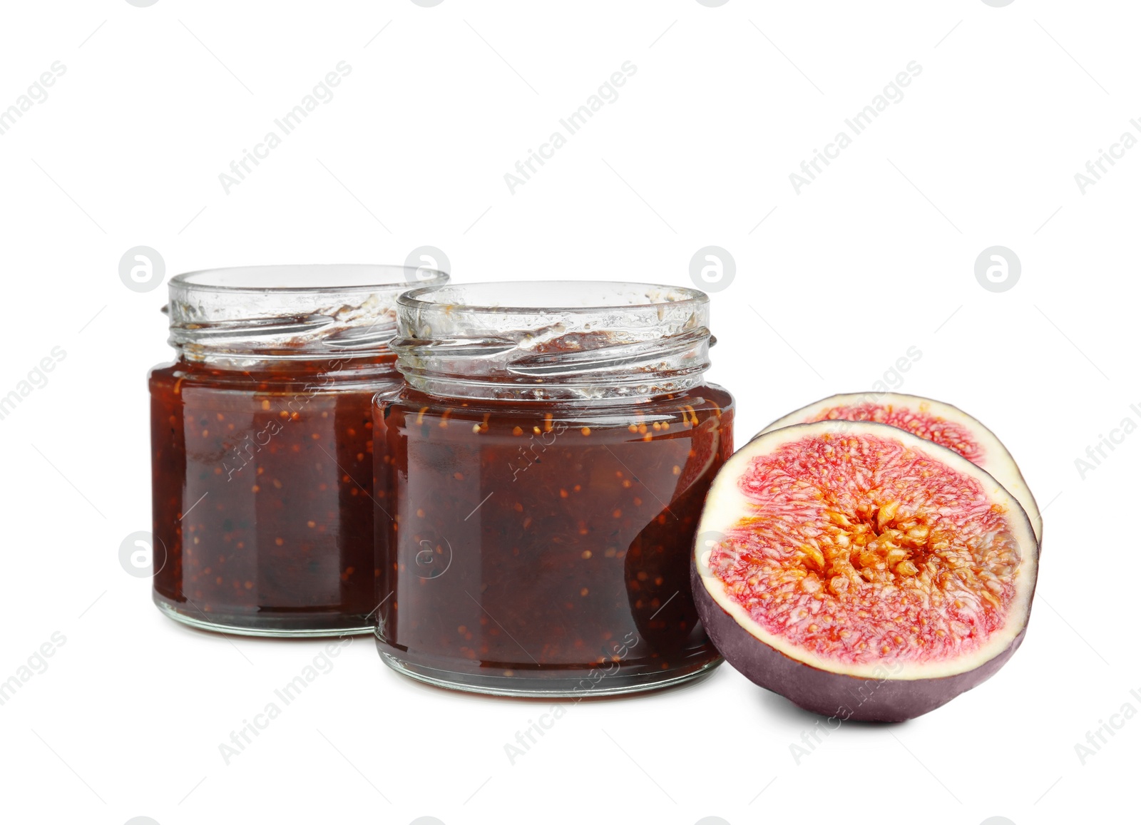 Photo of Glass jars of tasty sweet fig jam isolated on white