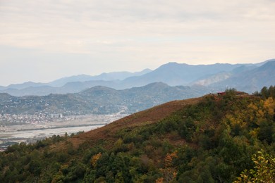 Picturesque view of beautiful valley, city and mountains