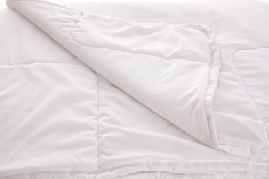 Photo of Clean soft white blanket as background, closeup