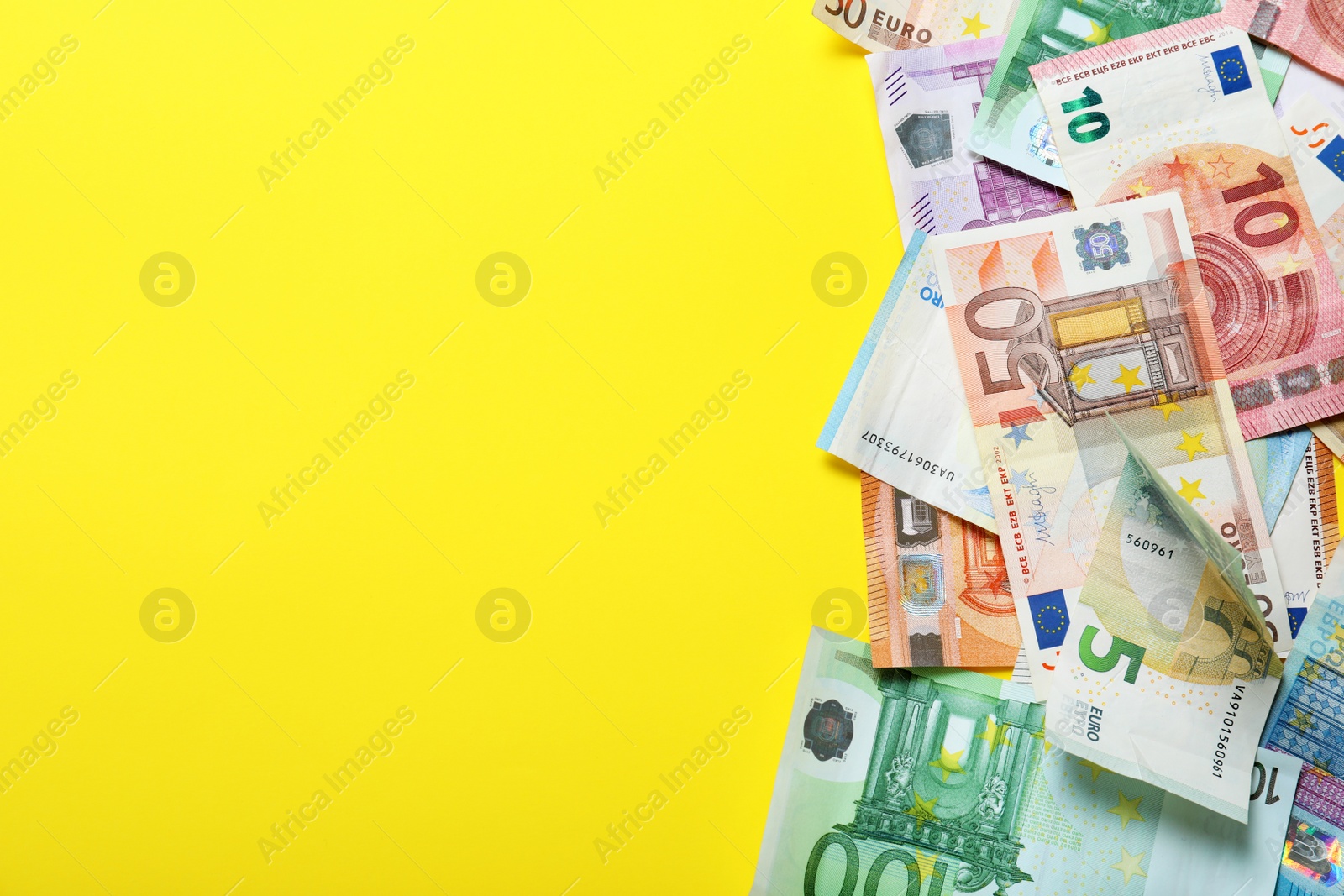 Image of Money on yellow background, flat lay. Space for text 