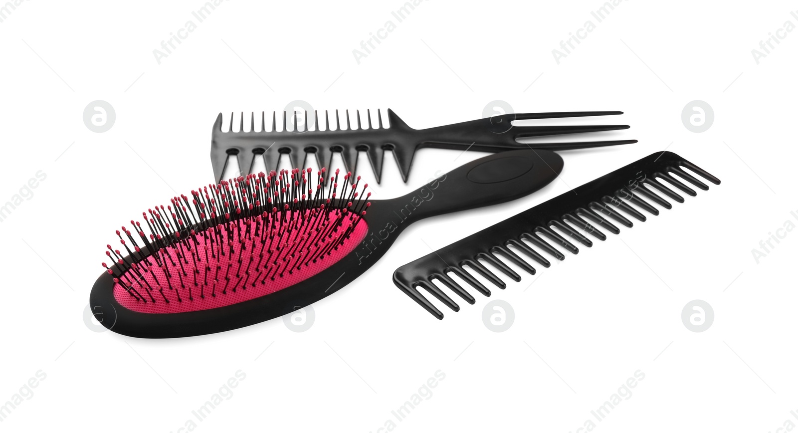 Photo of Set of hair brush and combs isolated on white