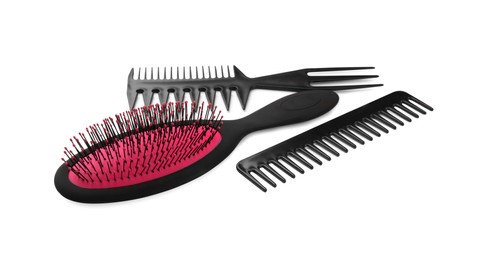 Photo of Set of hair brush and combs isolated on white