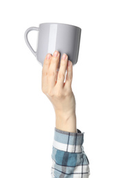 Woman holding cup on white background, closeup