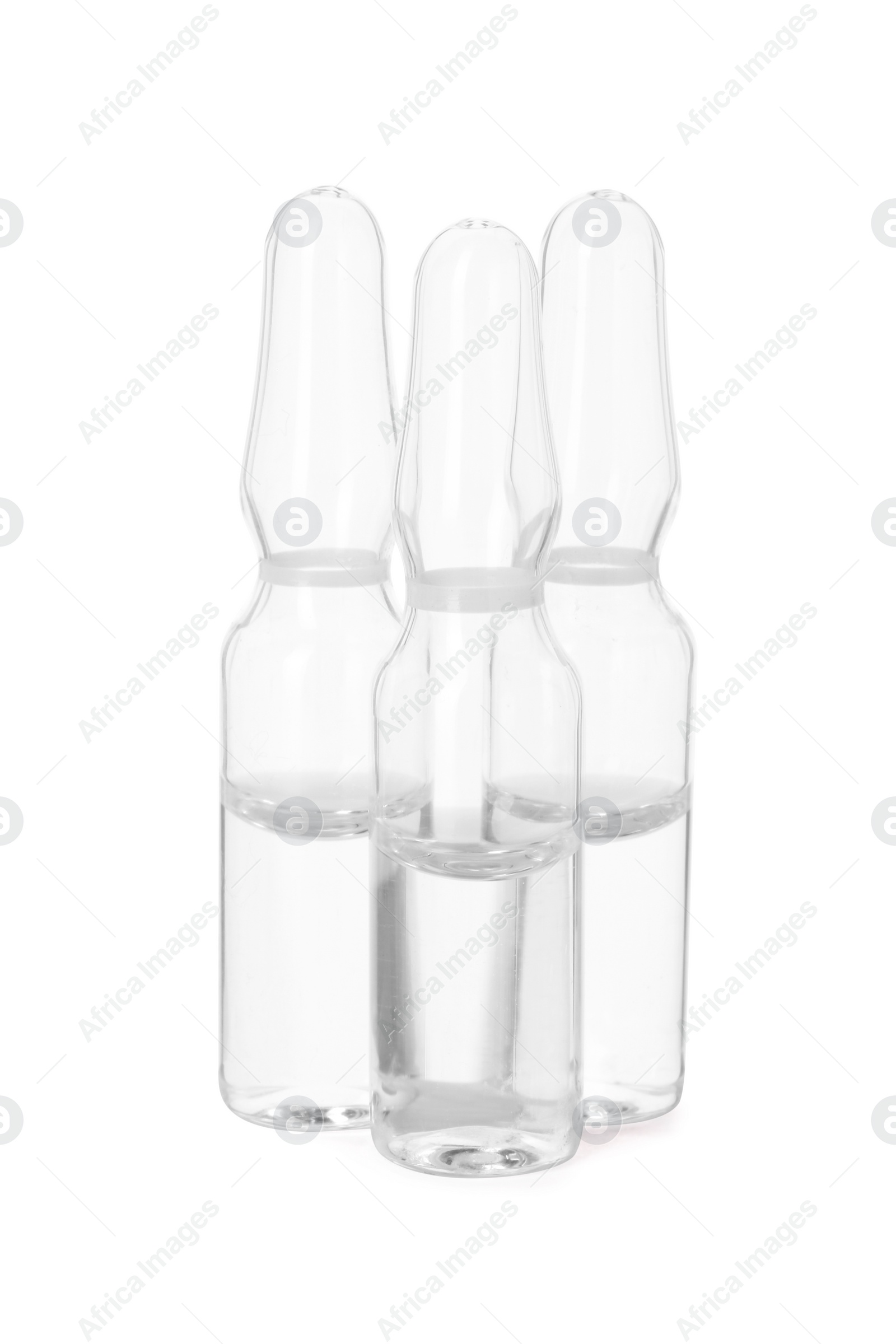 Photo of Glass ampoules with liquid isolated on white