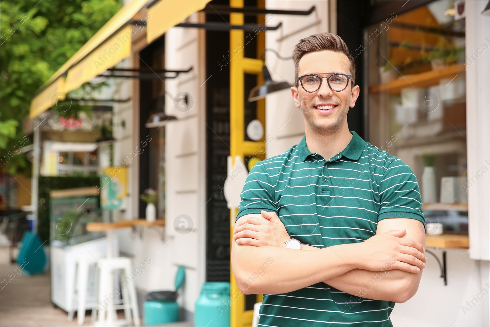 Photo of Portrait of attractive young man in stylish outfit outdoors