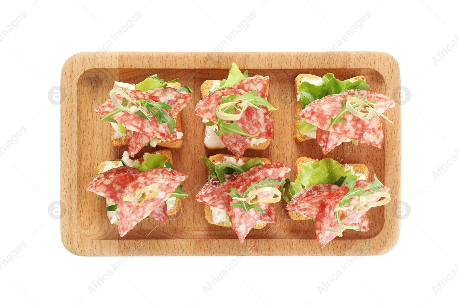 Photo of Tasty canapes with salami, greens and cream cheese isolated on white, top view