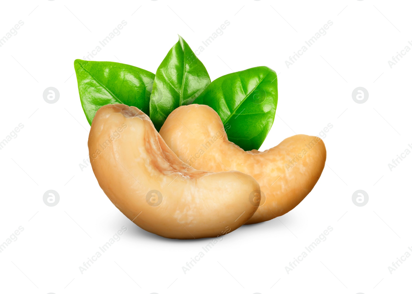 Image of Tasty cashew nuts and fresh green leaves on white background 