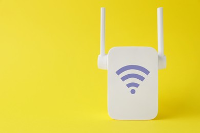 New modern repeater with Wi-Fi symbol on yellow background, space for text