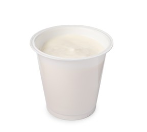 Photo of Plastic cup with delicious organic yogurt isolated on white