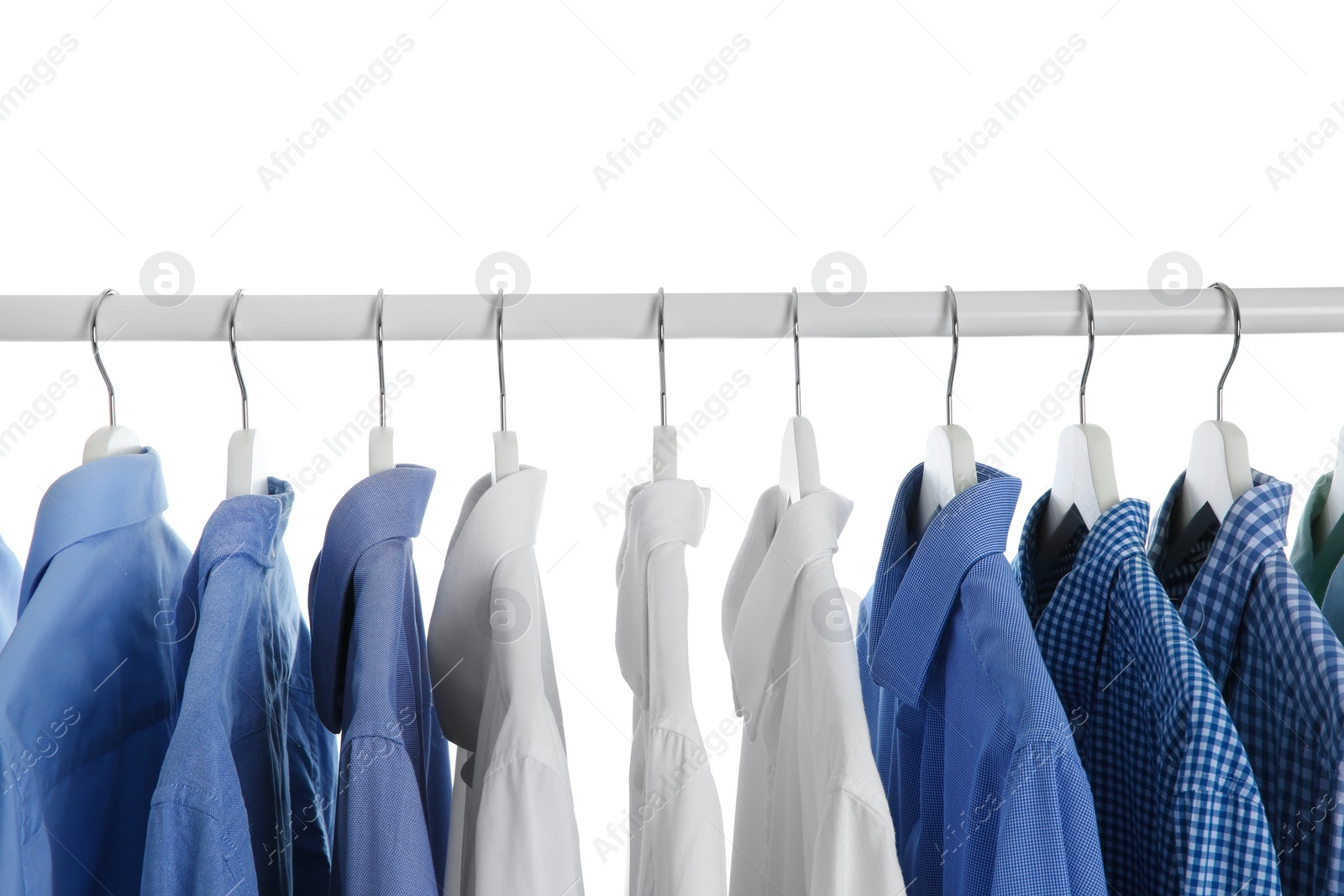 Photo of Men clothes hanging on wardrobe rack against white background, closeup