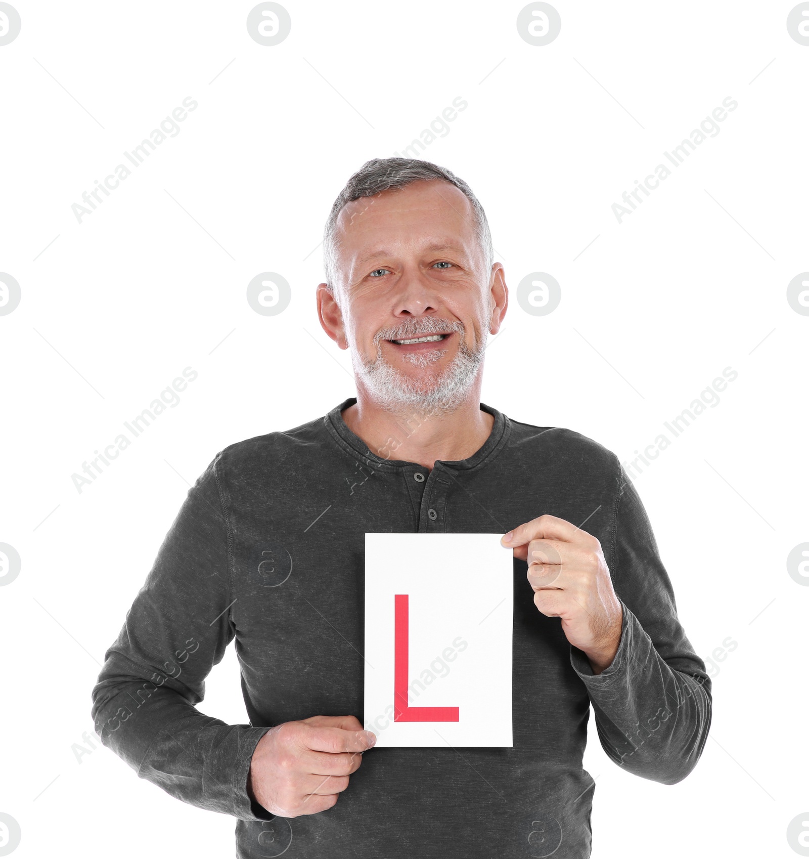 Photo of Happy mature man with L-plate on white background. Getting driving license