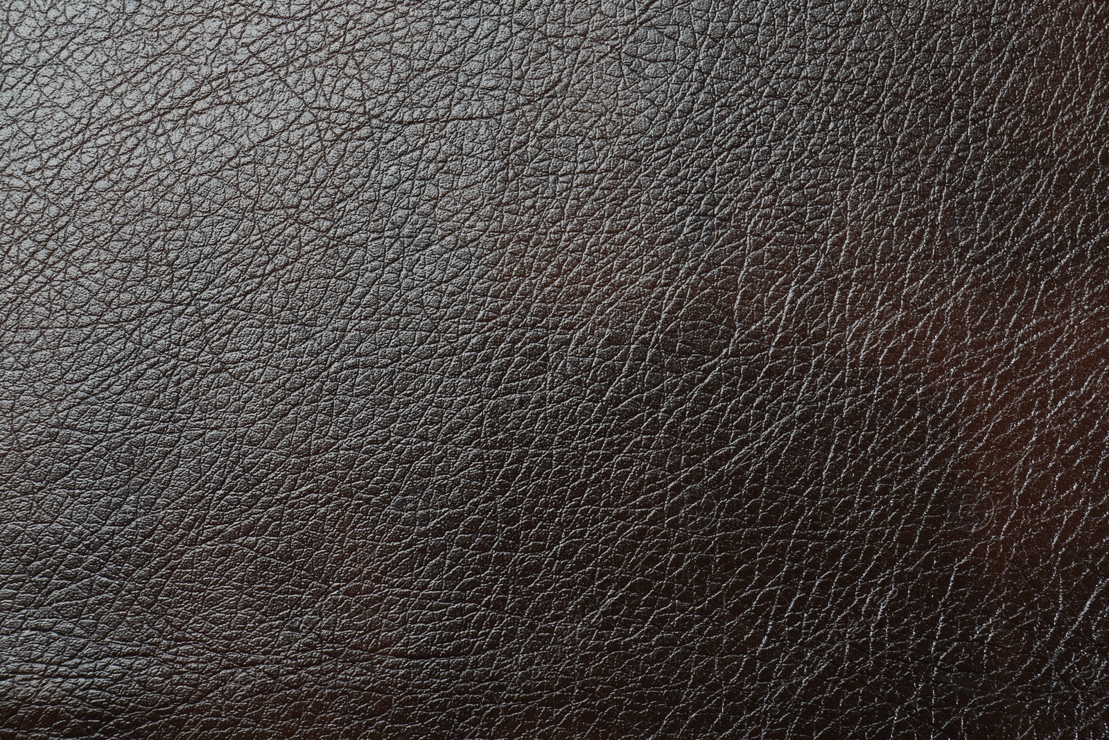 Photo of Texture of brown leather as background, top view