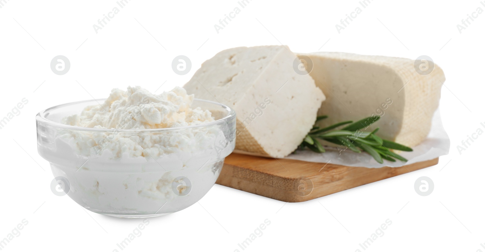 Photo of Different types of delicious tofu cheese with rosemary on white background