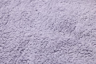 Photo of Texture of soft violet fabric as background, closeup