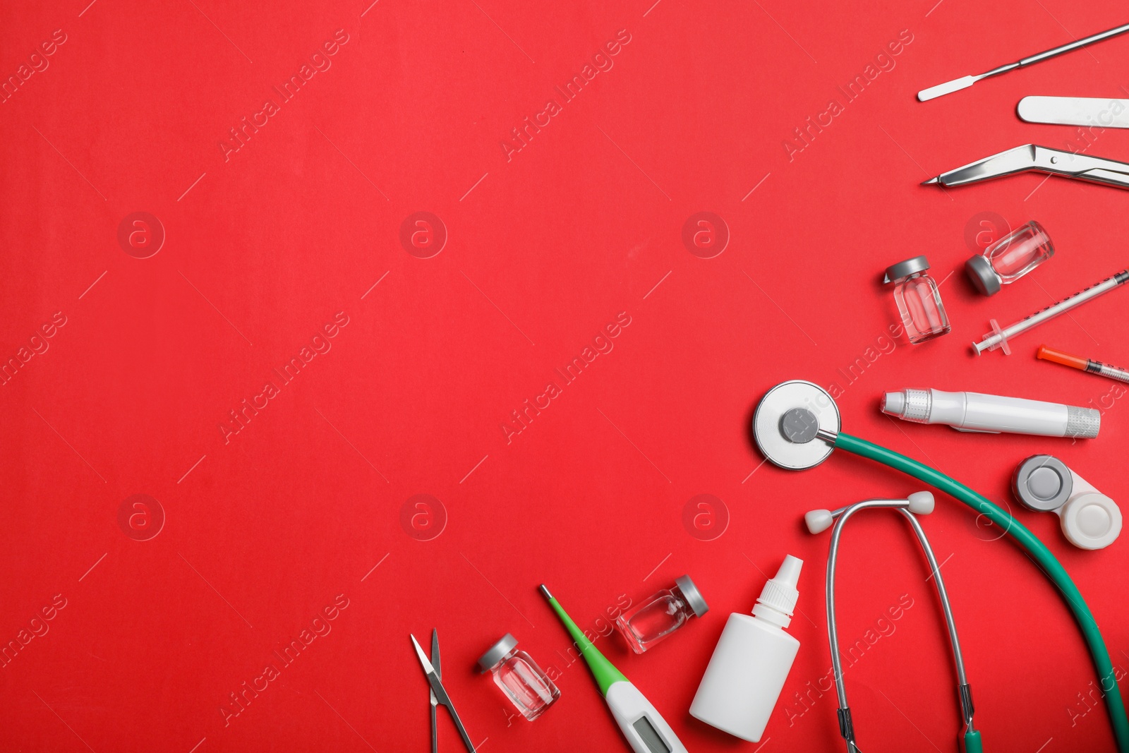 Photo of Flat lay composition with medical items and space for text on color background