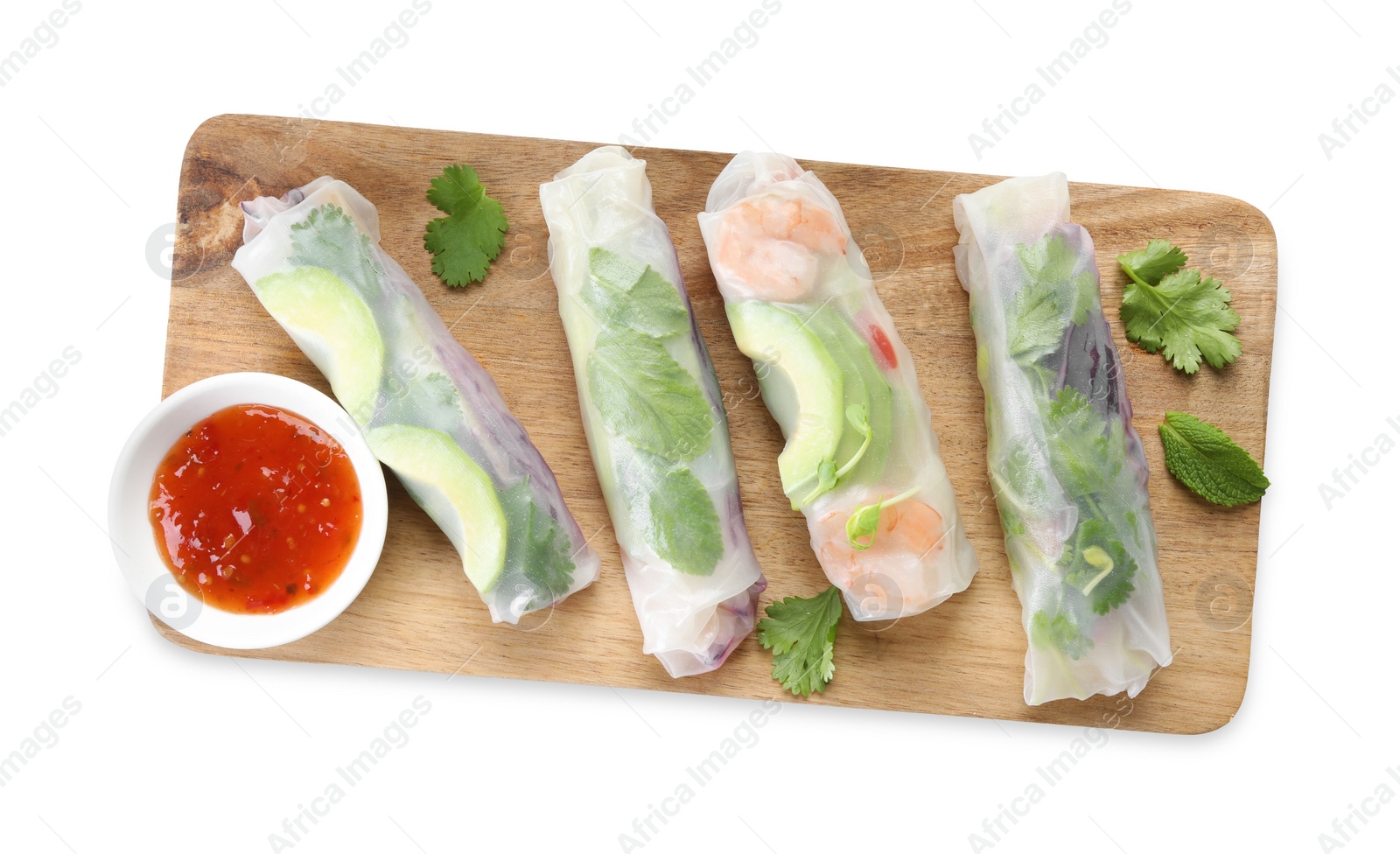 Photo of Delicious spring rolls and sauce isolated on white, top view