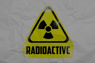 Radioactive sign on crumpled white paper. Hazard symbol