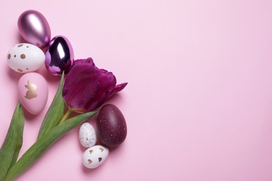 Photo of Flat lay composition with tulip and beautifully painted eggs on pink background, space for text. Easter celebration