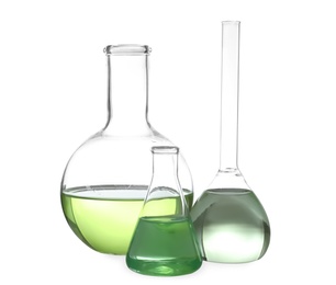 Glassware with liquids isolated on white. Laboratory analysis