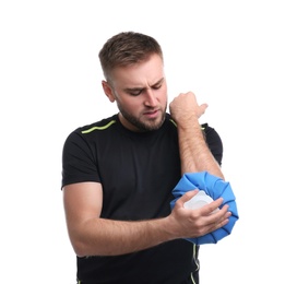 Photo of Young man with cold compress suffering from elbow pain on white background