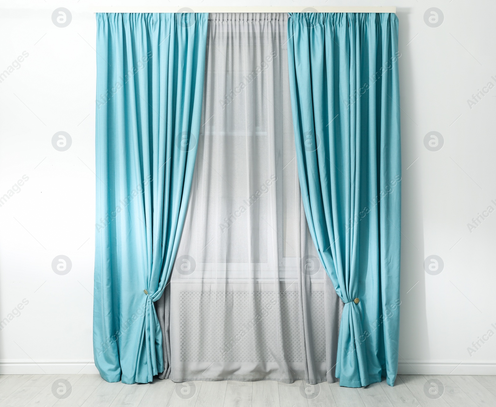 Photo of Modern window with beautiful curtains in room