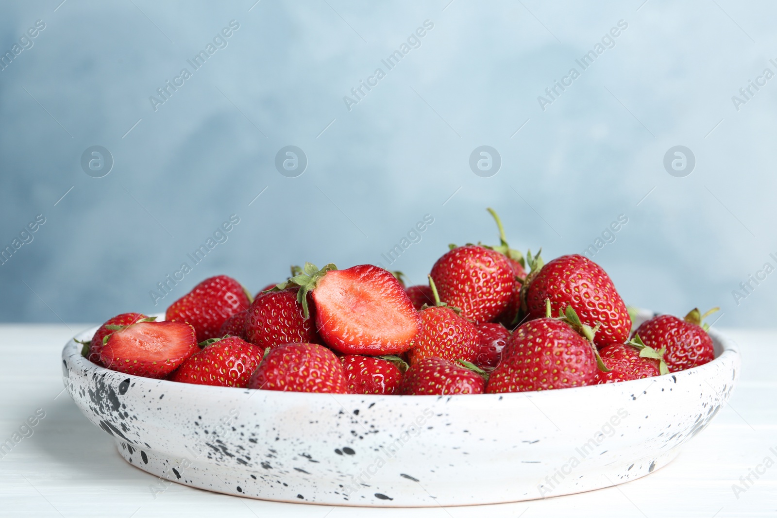 Photo of Delicious ripe strawberries on white plate, closeup