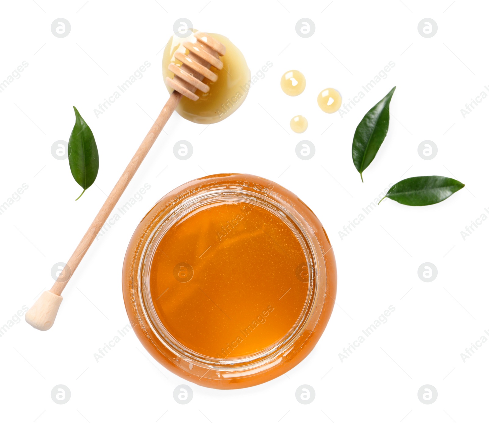 Photo of Tasty honey in glass jar, dipper and leaves isolated on white, top view