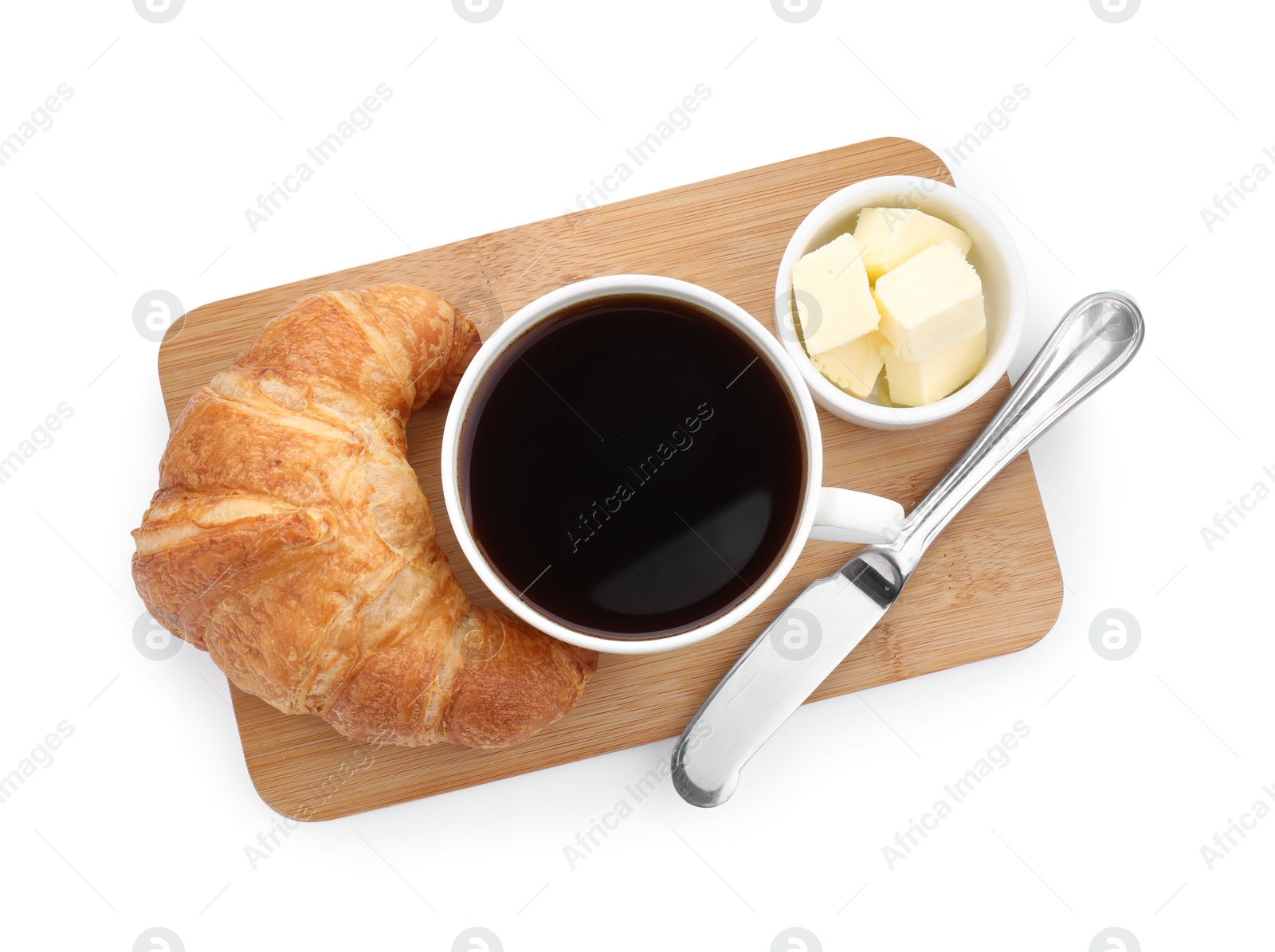 Photo of Fresh croissant, butter and coffee isolated on white, top view. Tasty breakfast