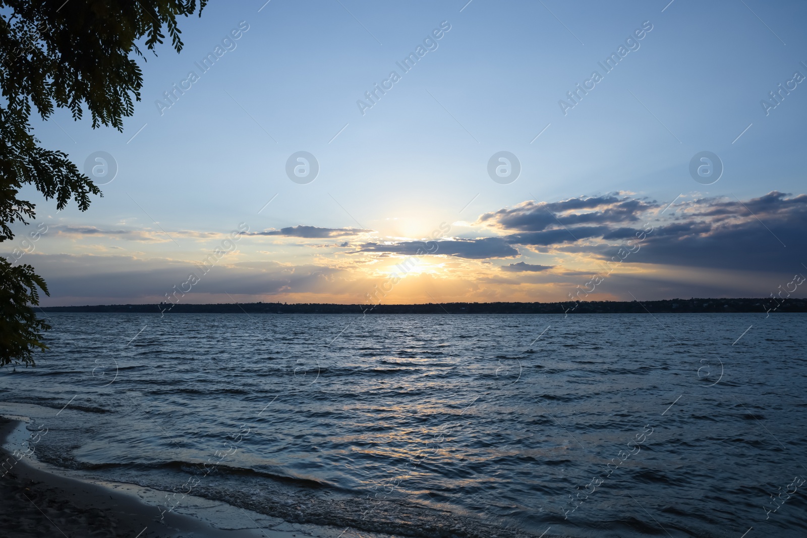 Photo of Picturesque view of tranquil river at sunset