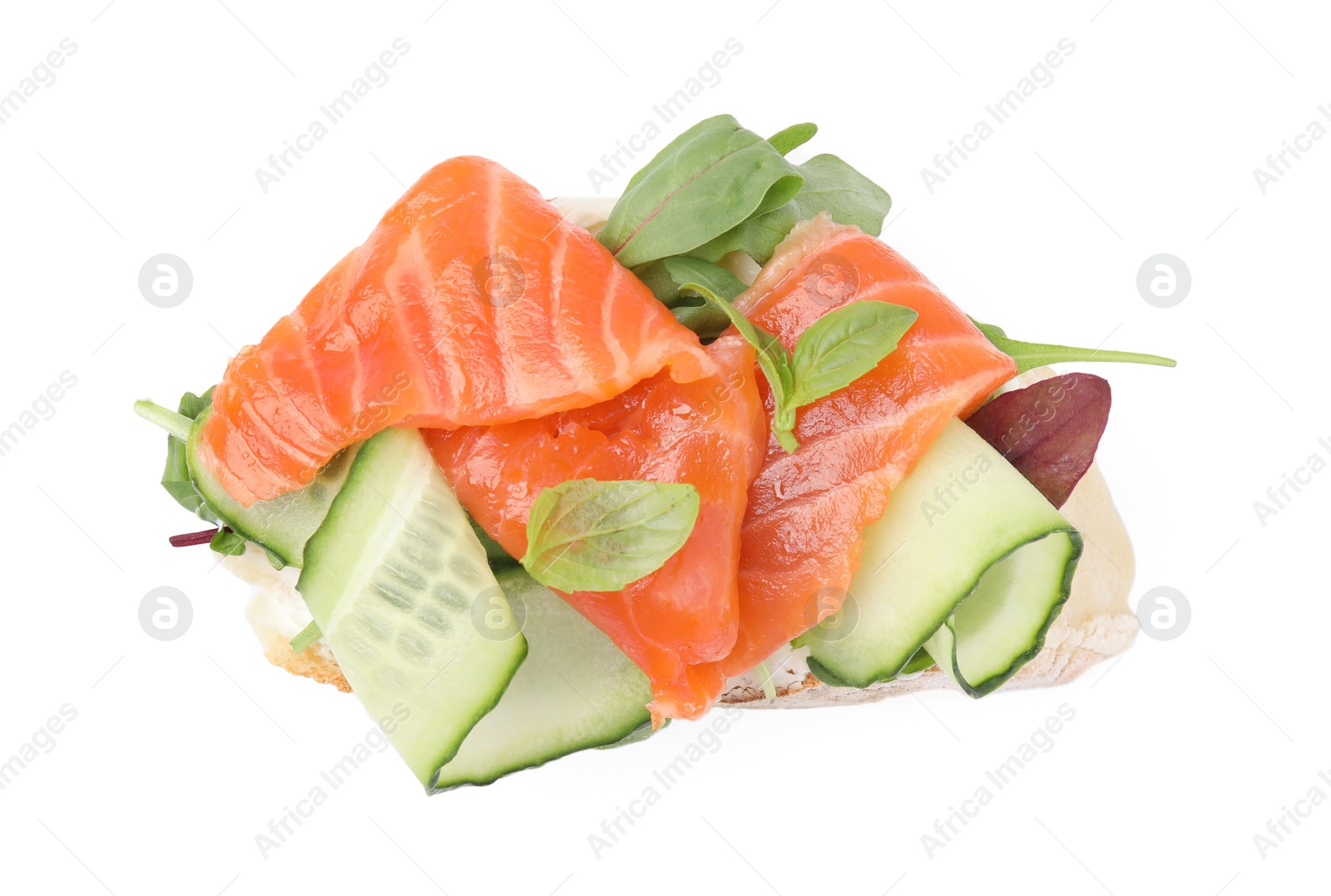 Photo of Tasty bruschetta with salmon, cucumbers and herbs on white background, top view