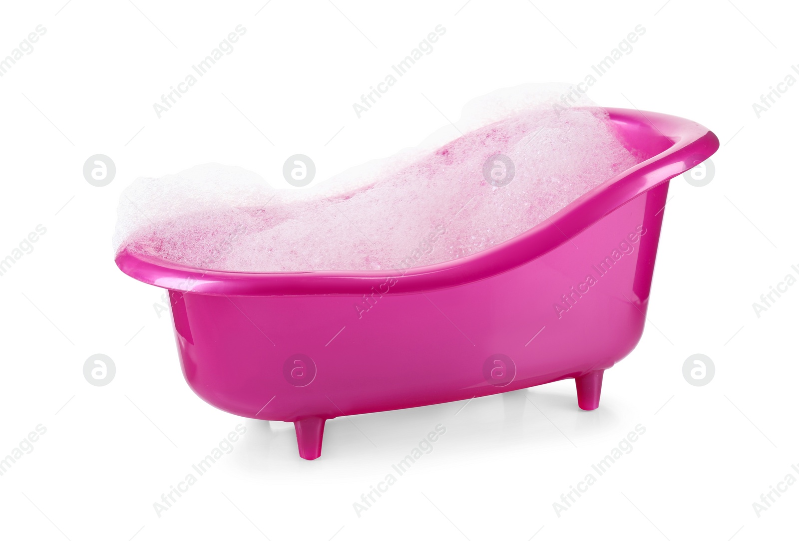 Photo of Pink toy bathtub with foam isolated on white