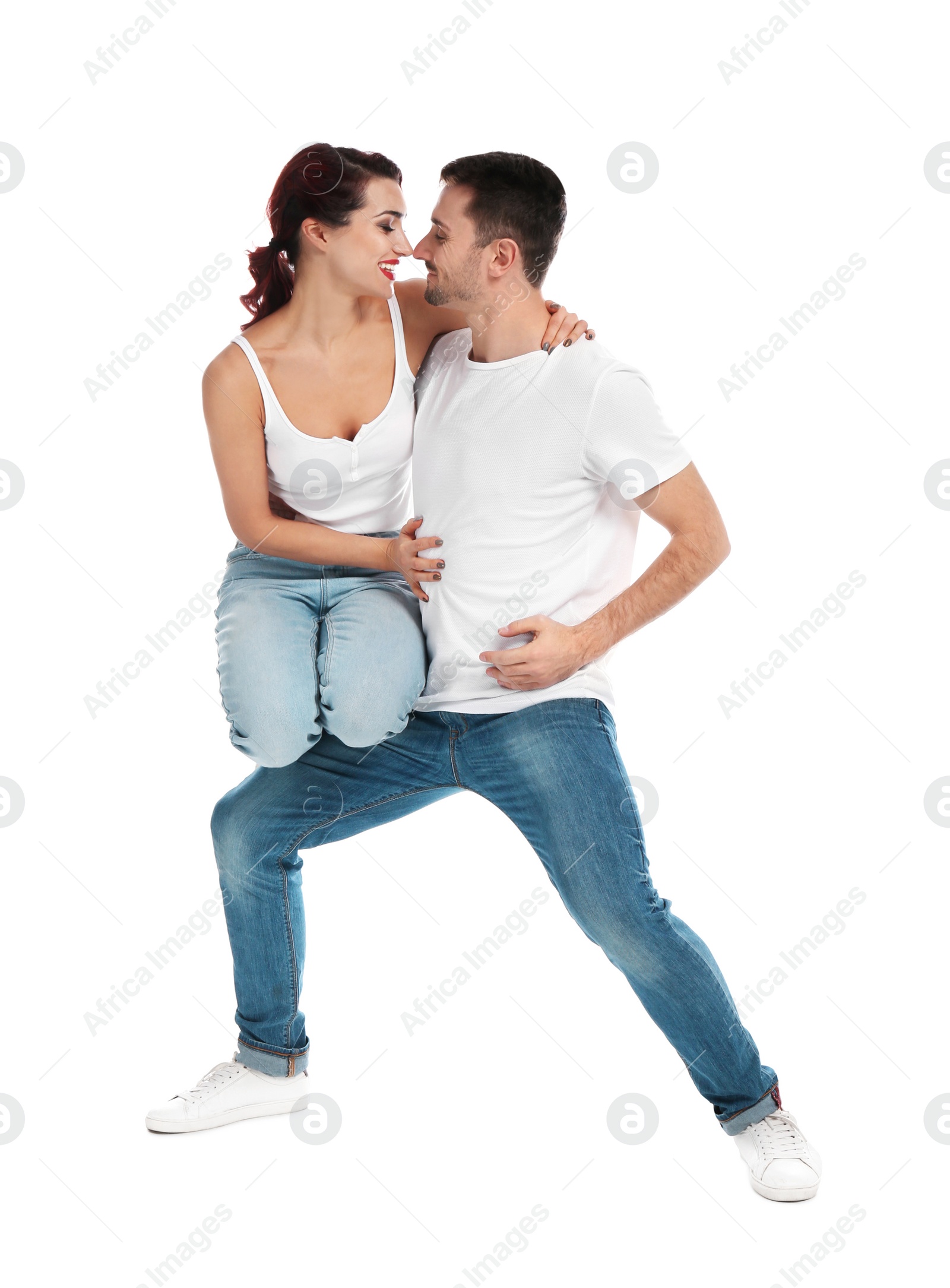 Photo of Beautiful young couple dancing on white background