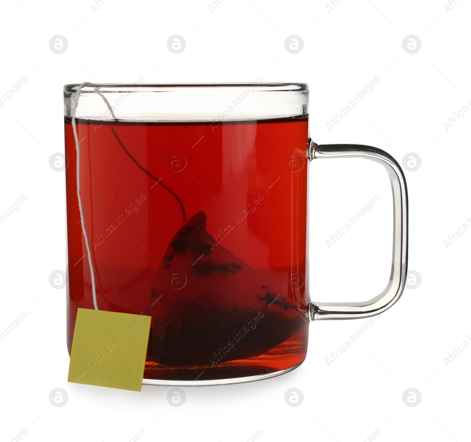 Photo of Tea bag in glass cup of hot water isolated on white