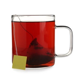 Photo of Tea bag in glass cup of hot water isolated on white