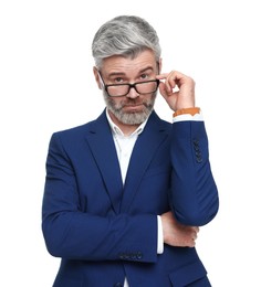 Mature businessman in stylish clothes posing on white background